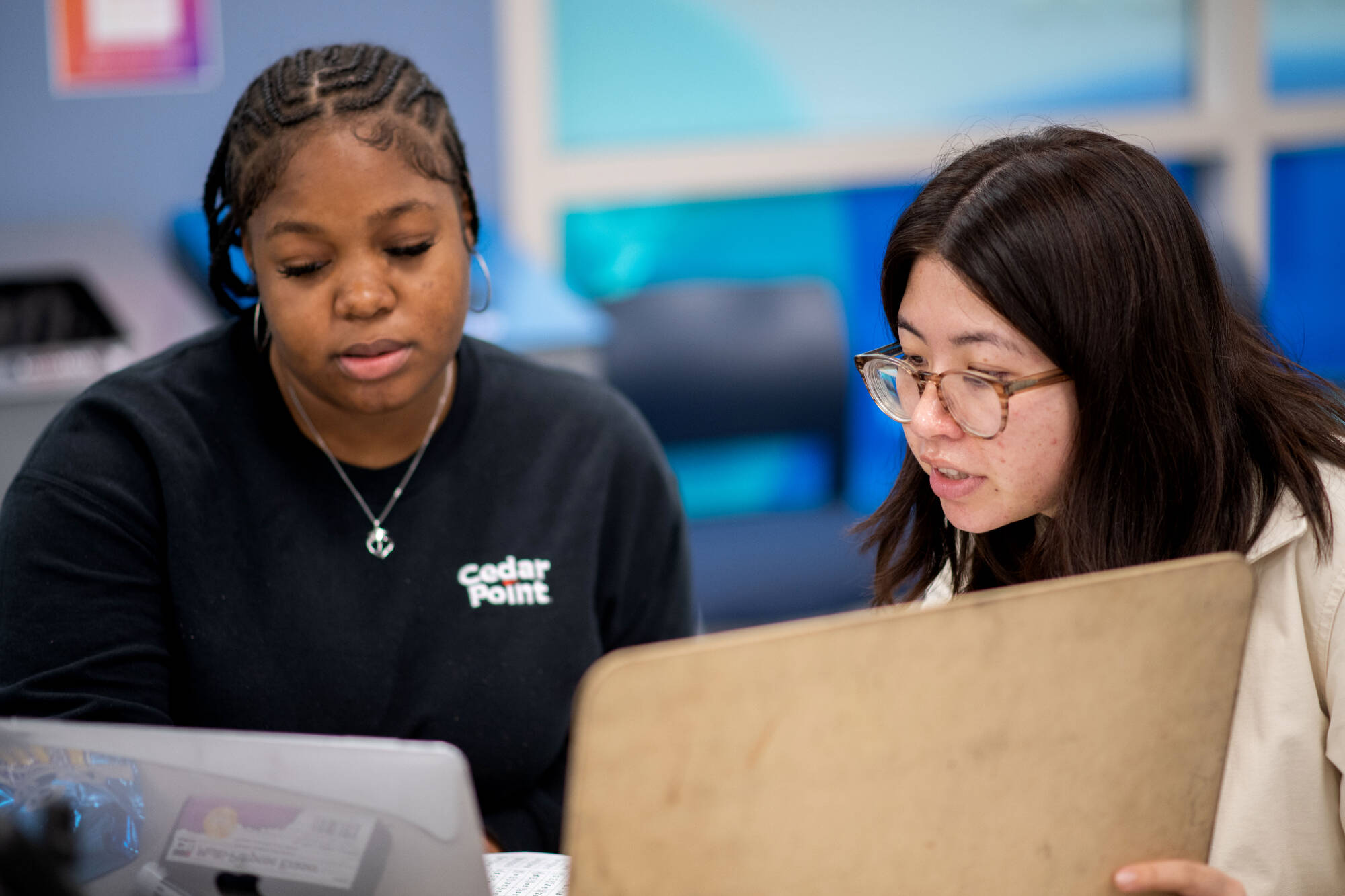 A tutor showing a student examples on an whiteboard